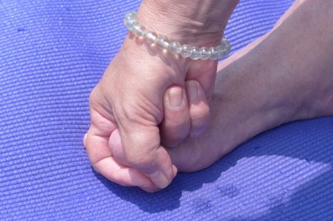2086284_web1_Yoga-Toe-Hold---Index-and-Middle-Fingers-wrap-around-big-toe.jpg