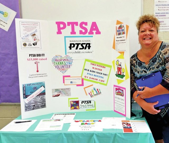 3960756_web1_Stephanie-Landers-stands-in-front-of-a-PTSA-booth-at-Waikoloa-Elementary-School-s-orientation201688182621677.jpg