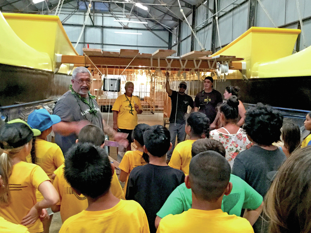 4749676_web1_Chadd-Paison-leads-Kohala-5th-graders-on-a-tour-of-Makali-i-in-the-warehouse201711113630676.jpg