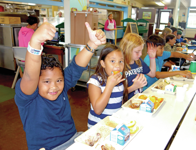 4794649_web1_Kohala-Elementary-3rd-grader-Ascher-Blanco-gives-two-thumbs-up-to-the-new-menu-at-his-school-cafeteria20171206563663.jpg
