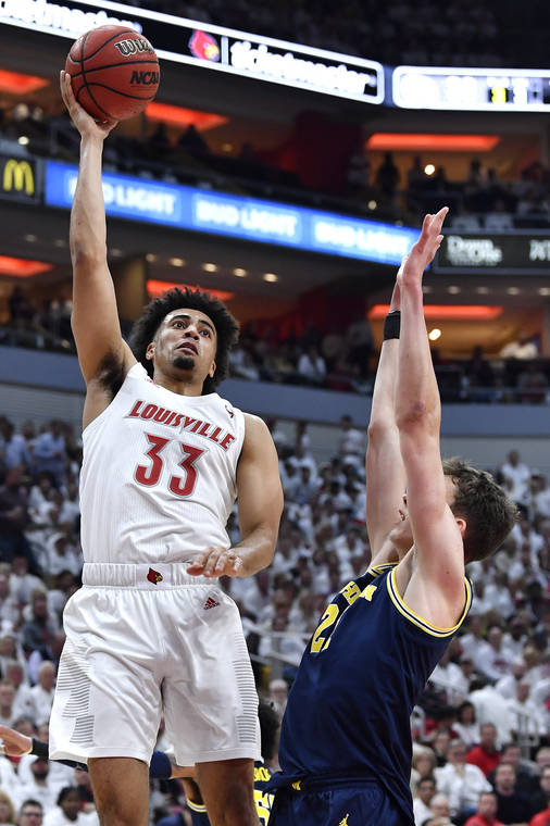 Jordan Nwora had a solid showing to help lead Louisville to a win over Michigan.  (Photo: Timothy D. Easley/Associated Press via West Hawaii Today.)
