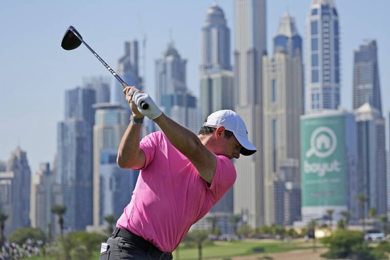 McIlroy leads by 3 in Dubai; Reed’s drive gets stuck in tree