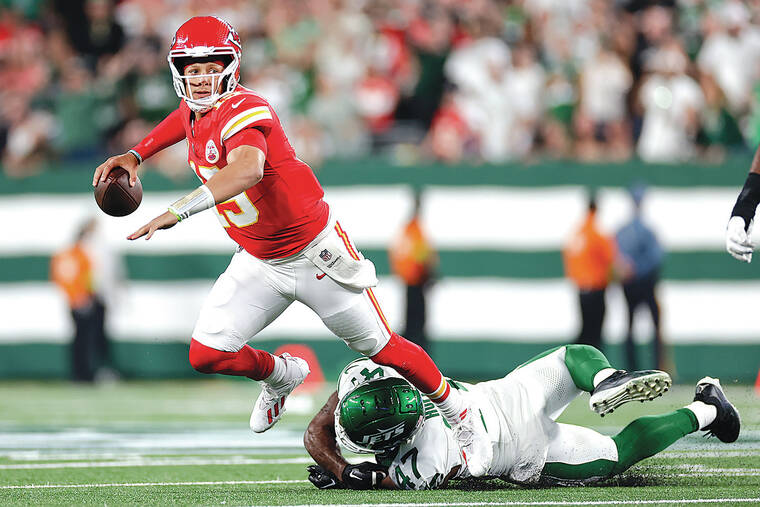 Patrick Mahomes, Chiefs withstand rally by Zach Wilson, Jets to win 23-20 -  West Hawaii Today