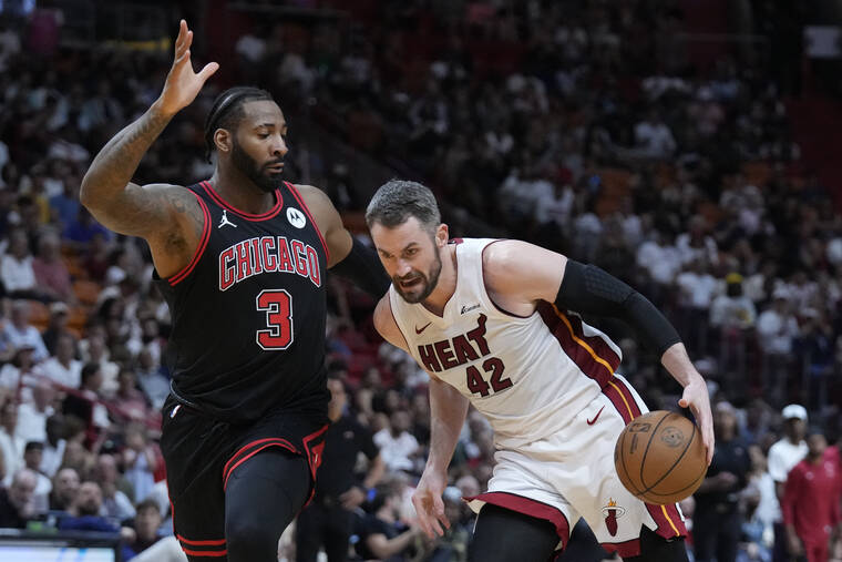 Heat beat the Bulls to clinch last playoff spot