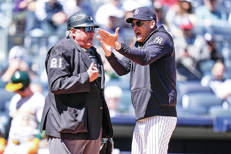 Yankees manager Aaron Boone is ejected 5 pitches into a game. He says a fan berated the umpire